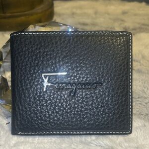 Salvatore Ferragamo bifold wallet with a silver-tone Gancini logo
